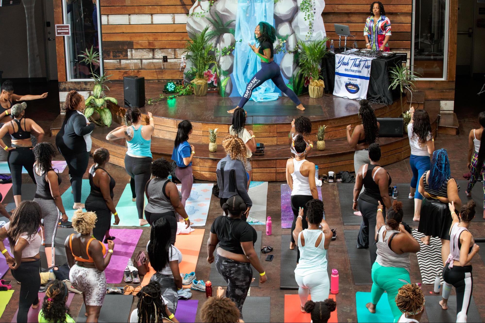 Guests doing yoga at Trap Yoga event