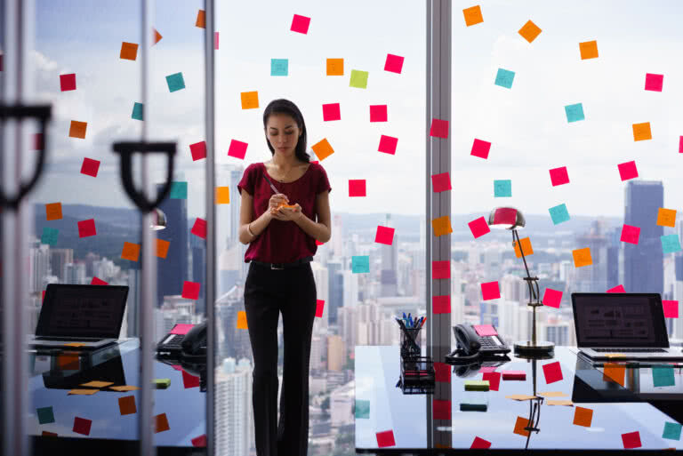 Event planner in an office with sticky notes