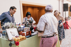 customer and sellers chatting at a community event