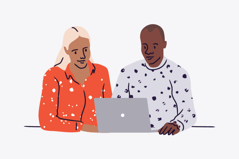 A man and woman planning an event at a laptop