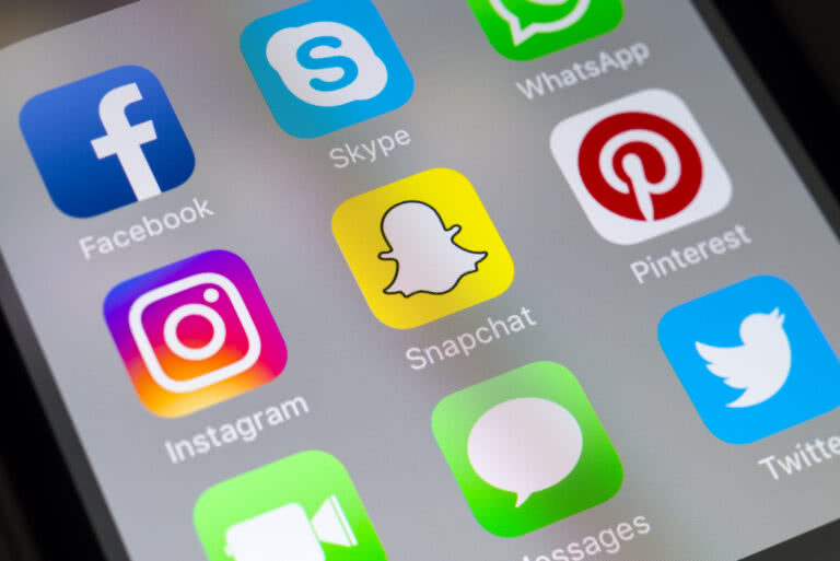 picture of mobile screen showing many social media apps.