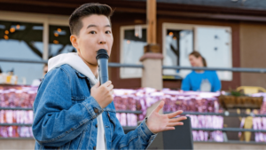 A poet on an outdoor stage