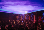 People partying under purple light