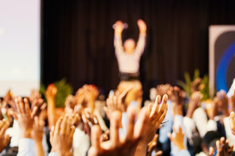 hands raised at event