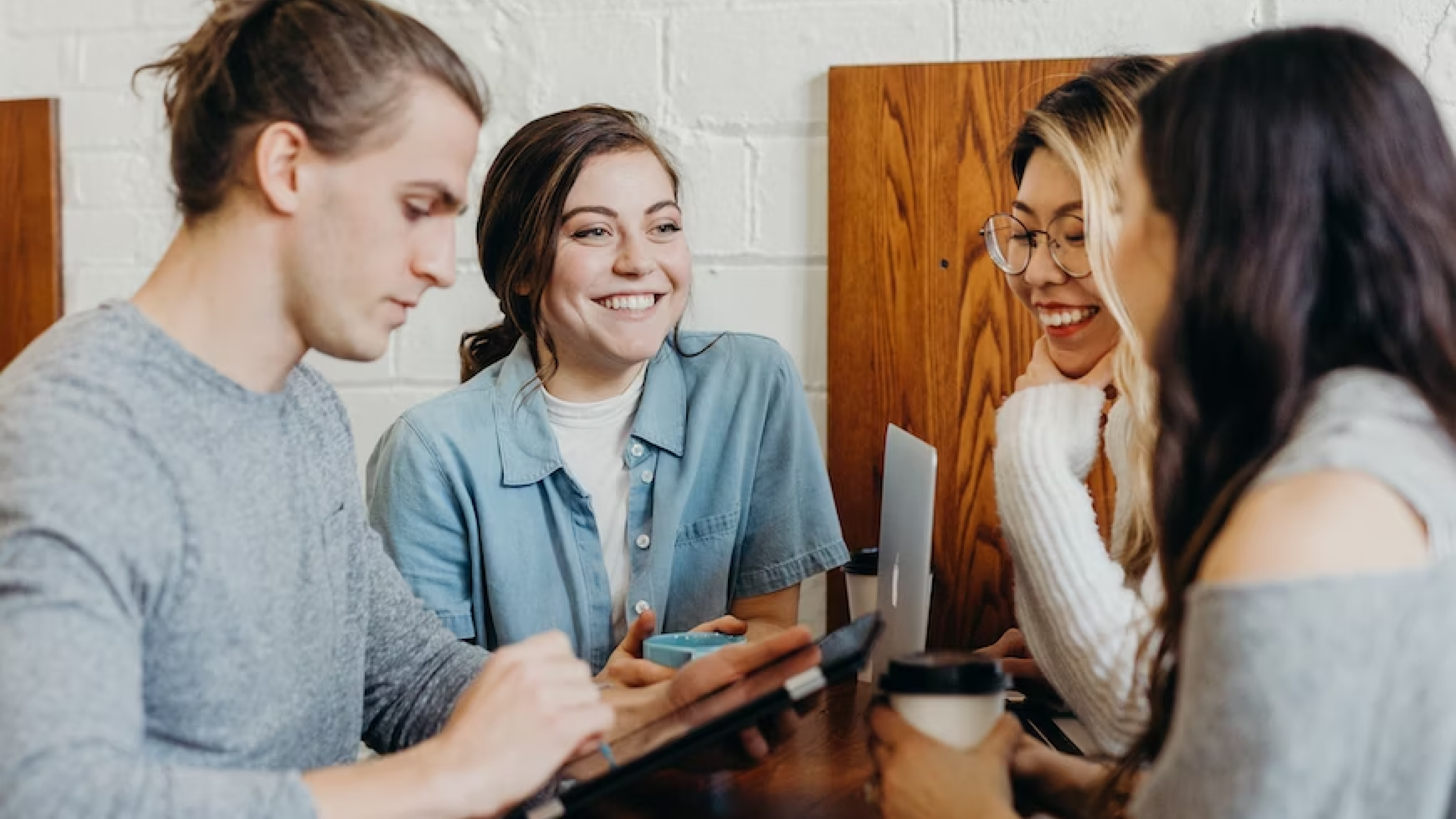 people standing around a computer planning an event