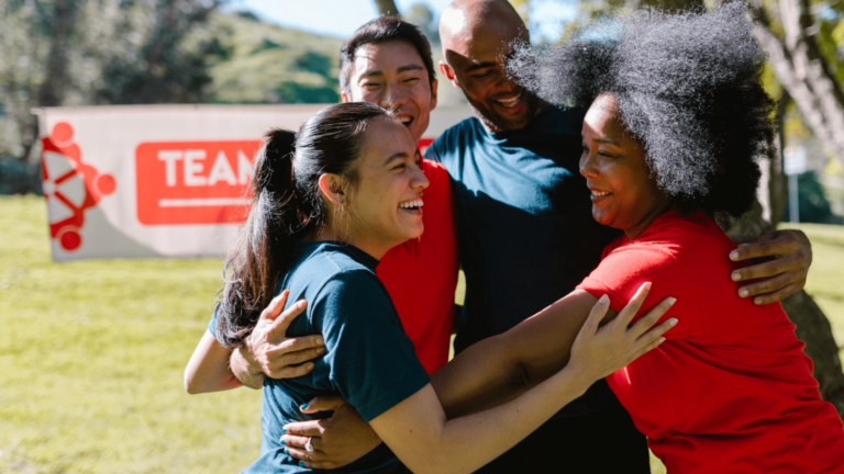 Group of friends hugging at fun run