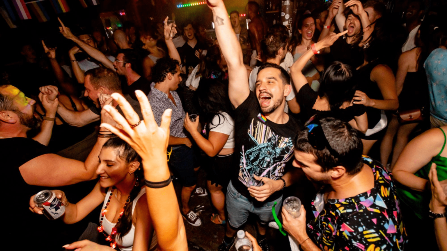 Man dancing in club enjoying music and nightlife.